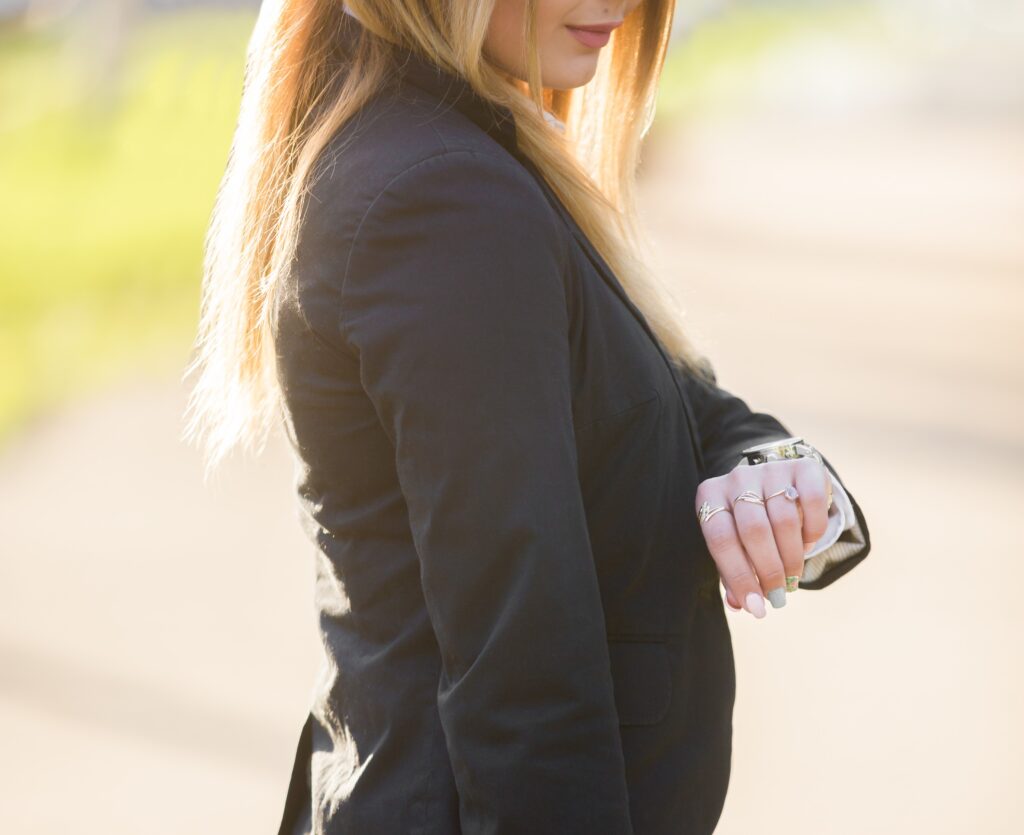 Young business lady looking at watch